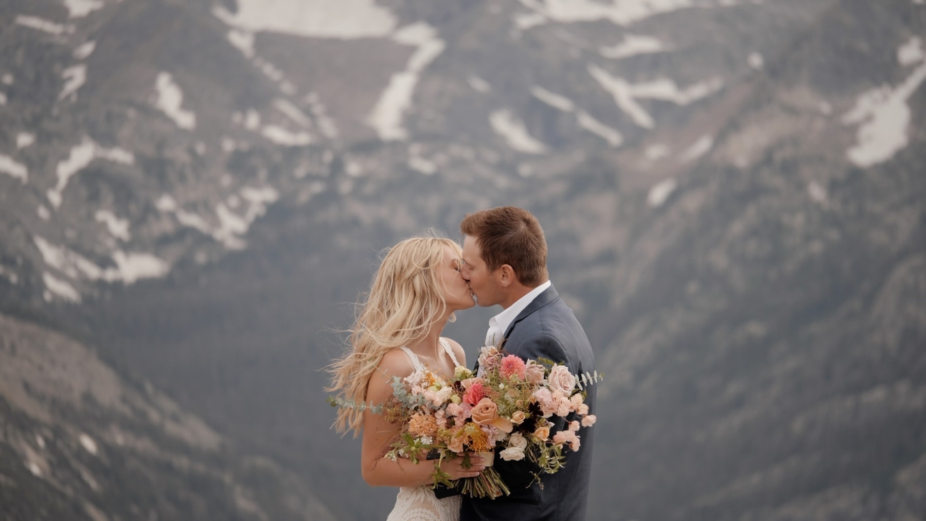 rocky mountain national park elopement videographer couple kisses trail ridge road